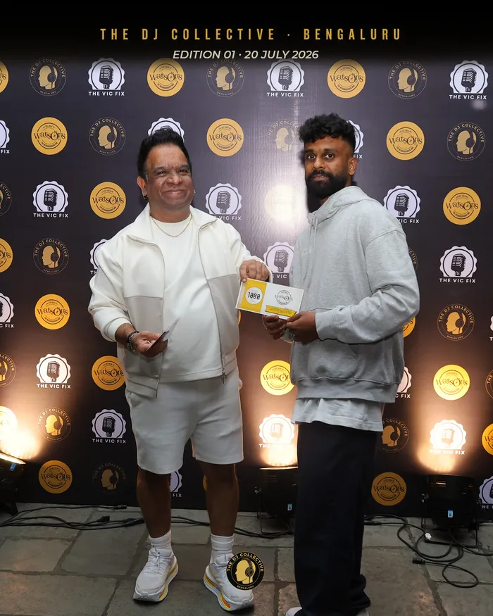 Two DJs comparing their name badges